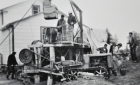 Cree men working around a construction site