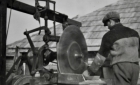 Man operating a mechanical saw 