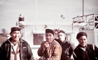 Cree and a non-Cree men in front of a schooner