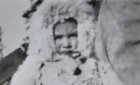 Young child wearing the traditional rabbit fur coat