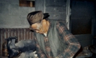 Cree man using an electric sanding stone