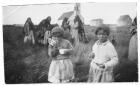 Cree girls eating bannock and drinking tea