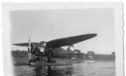 Pilot or missionary in front of a float plane